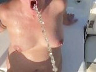 MILF gets golden shower on boat