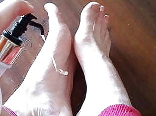 Rubbing lotion into my bare feet