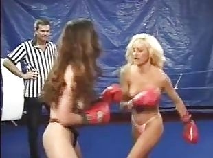 CatFight Topless female boxing as blonde battles brunette with body punches,