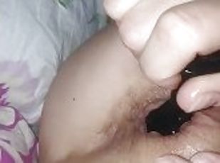 The wife takes out the anal plug from the tight ass. She said it hurts