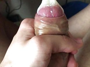 TEEN CUMS INSIDE A CONDOM