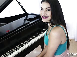 Beautiful brunette plays the piano and the dick afterwards