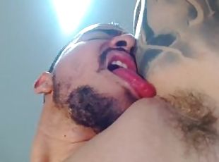 Caressing nipples of muscular Latino