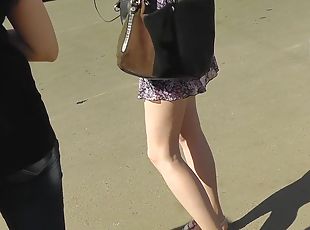 Cute leggy beauty being upskirted