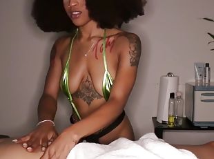 Massaging ebony babe loves stroking dick after massage