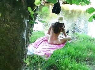 SOLO GIRL EXHIBITING OUTDOOR AT THE RIVER